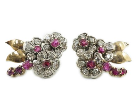 A pair of 1950's gold ruby and diamond set triple flower head cluster earrings, 24mm, gross weight 6.6 grams.