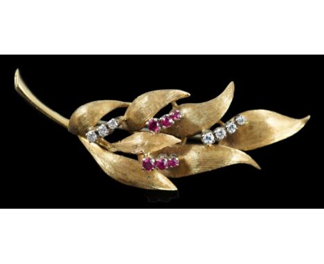 A 1960's 18ct gold, six stone ruby and seven stone diamond chip set leaf spray brooch, 55mm, gross weight 8.2 grams.