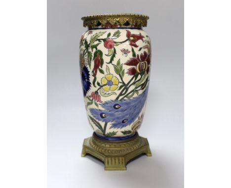 A Zsolnay Pecs brass mounted vase decorated with a peacock amongst flowers, 30cm high