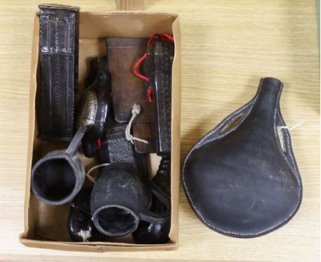 A quantity of stamped leather items including two flasks, two  small tankards etc, largest flask 25cm high