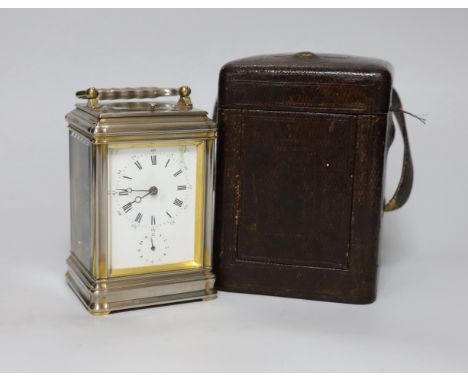 A gorge-cased repeating carriage clock with enamel dial, numbered 15446 to the base, 16cm high, in travelling case