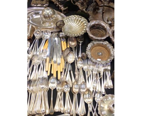 A QUANTITY OF SILVER-PLATED WAREa fox stirrup cup, a shell dish, bottle coasters, a pair of chamber sticks, part canteens etc