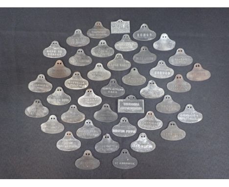 A COLLECTION OF VINTAGE CAST METAL PLANT LABELS