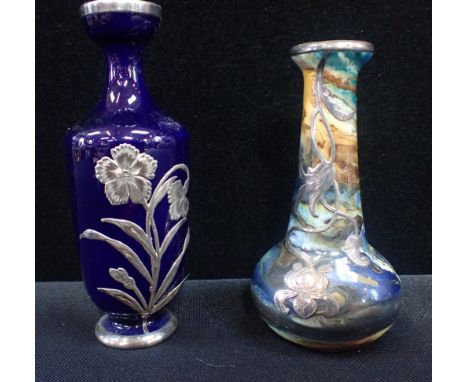 TWO SMALL SILVER OVERLAID CERAMIC VASESone in the Art Nouveau style 10.5cm high, the other with carnation against a plain blu