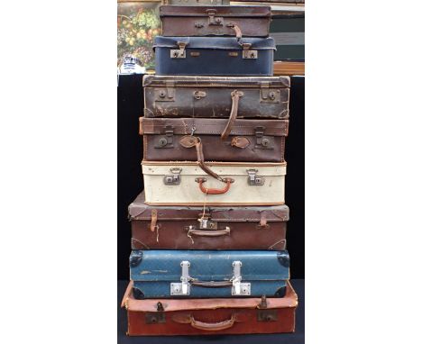 A COLLECTION OF VINTAGE SUITCASESsome with keys, with some wicker bags and baskets.