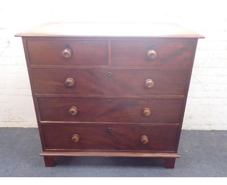 A VICTORIAN MAHOGANY CHEST OF DRAWERSwith turned knobs and escutcheons, on later bracket feet 110cm wide