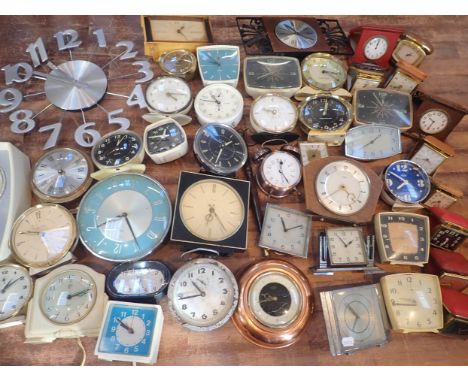 A QUANTITY OF VINTAGE AND RETRO CLOCKSincluding a Mappin Art Deco desk clock (a/f), travel and alarm clocks etc (many in need