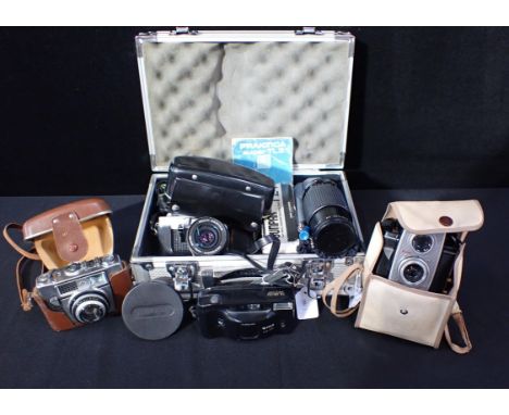 A PRAKTIKA SUPER TL3 35MM SLR CAMERAwith manual, Sunpak T24 flash, Fujinon 55mm lens, Makinon 80-200mm lens and Olympus A28 H