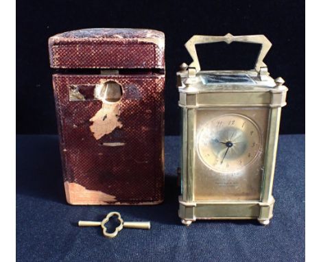 A FRENCH CARRIAGE TIMEPIECEretailed Harrison and Son, Darlington, with gilt dial, angular handle and finials and canted corne
