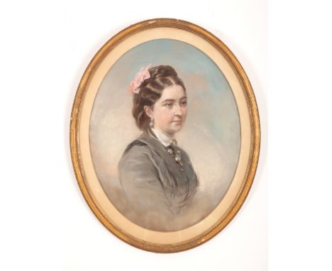A VICTORIAN OVAL PORTRAIT OF A LADYunsigned, pastel on paper, with pink ribbon in hair, donned in black with turquoise jewell