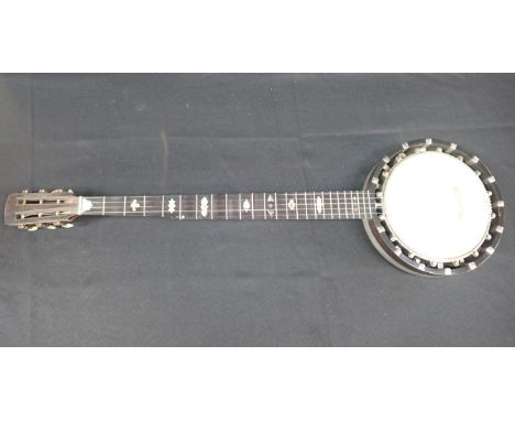 A BANJO BY J.E. DALLAS, 415 STRAND W.C.numbered 4310, nickel-plated mounts, shell inlay and carving to the neck, 90cm long , 