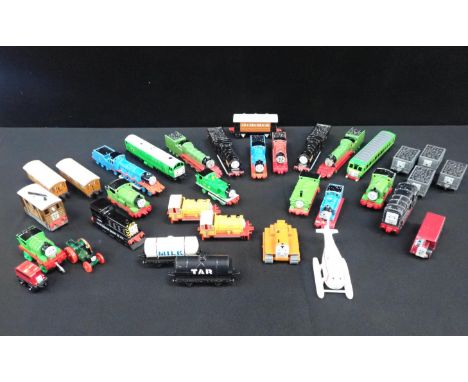 ERTL 'THOMAS THE TANK ENGINE' LOCOMOTIVES AND ROLLING STOCKthirty one loose Ertl models, in played with condition. With three