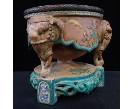 A 19th CENTURY ORIENTALIST ELEPHANT HEAD OIL LAMP BASE(only) three Indian elephant heads supporting a circular metal fitting,