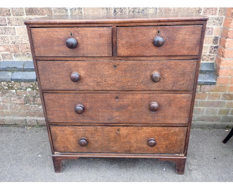 A 19th CENTURY COUNTRY OAK CHEST OF DRAWERSwith thin ebonised banding to the drawers, turned knobs and bracket feet, 95cm wid