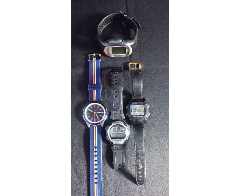 A LACOSTE GENTLEMAN'S WRISTWATCHwith blue dial and bezel, and baton markers, two digital watches and a digital stopwatch (4)