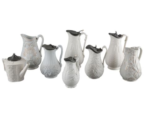 A VICTORIAN RELIEF MOULDED TEAPOT BY BROWNFIELD & SONmarked to the base, in the 'Mistletoe pattern', with a pewter lid, 17cm 