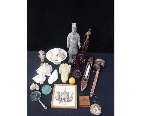 A TIBETAN PRAYER WHEELwith other items, including marble eggs, sea shells, a textile shuttle, a terracotta warrior etc
