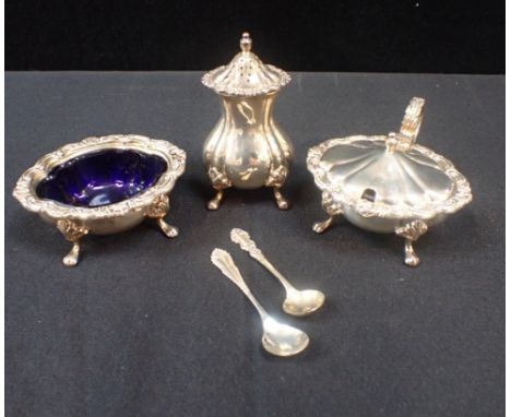 AN ELIZABETH II SILVER THREE PIECE CRUETby AC & S, London, of 18th Century design, the panelled oval bodies with leaf scroll 