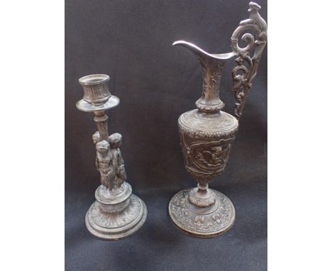 A BRONZED CAST METAL EWERin Renaissance style, 29cm high, and a similar candlestick 21cm high (2)