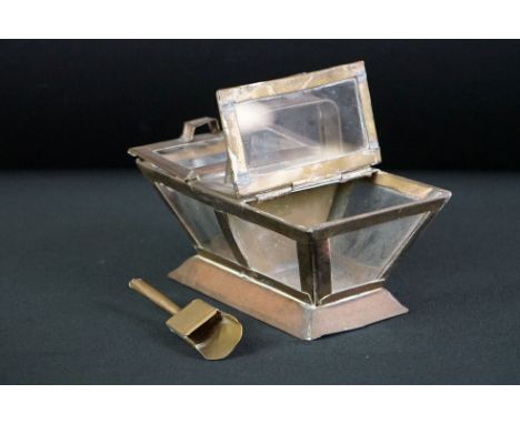 An Arts &amp; Crafts style tea caddy with brass caddy spoon. 