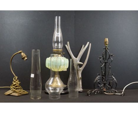 Edwardian oil lamp with uranium glass reserve, fluted glass chimney, brass stem raised on a black ceramic pedestal base, appr