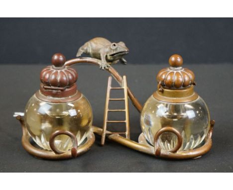 An antique copper gilt double ink well / standish with from and ladder decoration. 