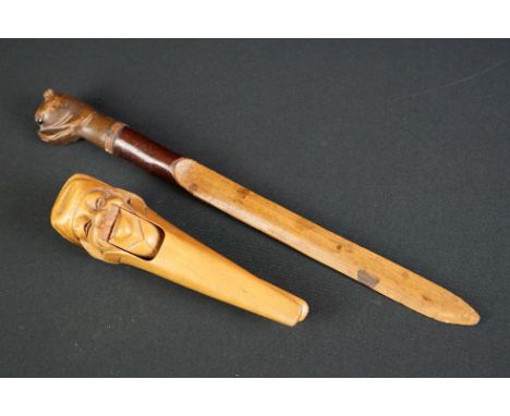 A treen letter opener with pug dog finial together with figural nut cracker. 