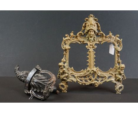 Late 19th century cast iron door knocker modelled as an eagle, 25cm high, together with a French Rococo style brass double ph