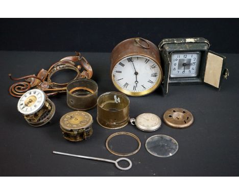 A small collection of old clocks and clock parts. 