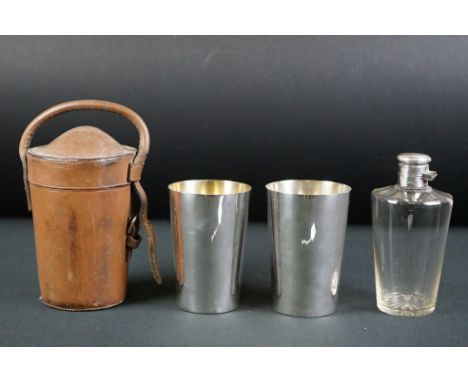 A leather cased hip flask and stirrup cup set by James Dixon &amp; Sons. 