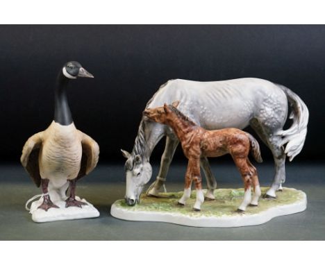 Goebel porcelain figure group of a grazing horse and foal, no. 3230318, dated 1974, 26.5cm long, plus a Goebel figure of a go