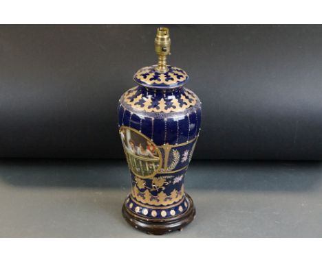 Vienna Style porcelain lamp base with transfer printed panels depicting young ladies on cobalt blue ground, gilt and enamelle