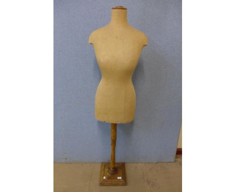 A vintage mannequin on stand 