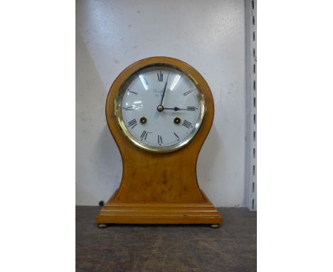 A Franz Hermle maple balloon shaped mantel clock 