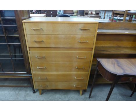 A light oak chest of drawers 