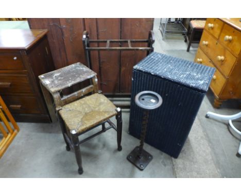 A rush seated stool, a wicker basket, a stick stand, etc. 