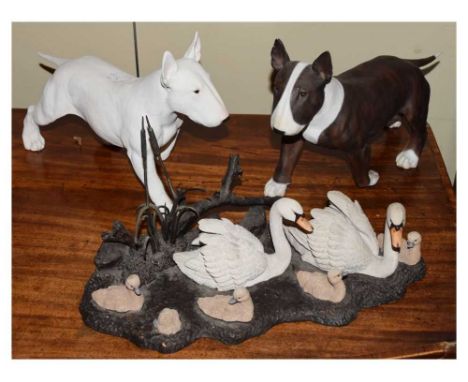 Two Godfrey for North Light dog figures (32cm x 21cm high), together with a set of swans