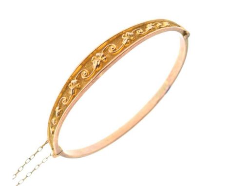 9ct gold hollow snap bangle having floral scrollwork decoration, Birmingham 1911, 5.9cm internal diameter approx, 5.5g approx
