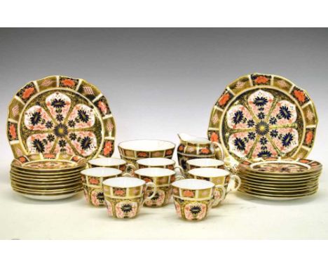 Royal Crown Derby Imari pattern part-tea service of eight cups and saucers, tea plates, milk jug, sugar and two serving plate