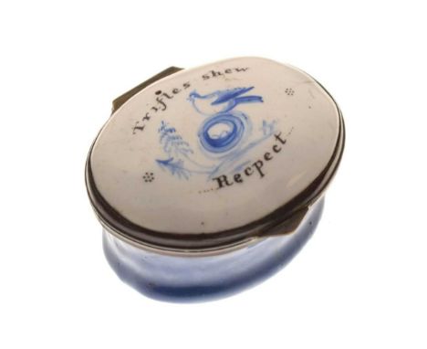 Georgian oval enamel patch box of Bilston type, the hinged cover decorated in blue with a bird perching upon a nest, inscribe