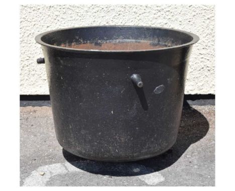 Iron planter or vessel, with three lugs, drilled drainage holes to rounded base, 58cm diameter x 44cm high