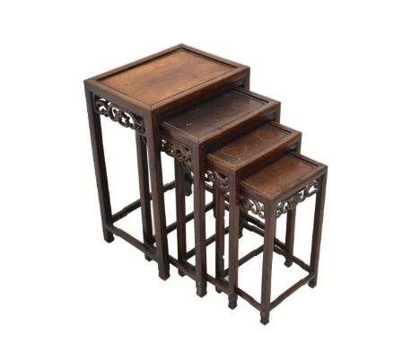 Chinese hardwood nest of four 'quartetto' tables, each with scroll apron and shaped stretchers, largest 44.5cm x 33cm x 66cm 