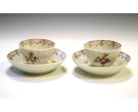 Two late 18th Century wrythen moulded tea bowls and saucers, possibly New Hall, both with painted with floral sprays, 5cm hig