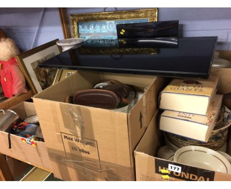 A shelf of assorted to include a TV