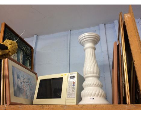 A shelf of assorted, to include a microwave