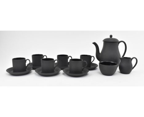 Wedgwood - a vintage 20th century black basalt coffee service. The service comprising coffee pot, six cans and saucers, a sma