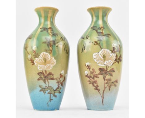 A pair of vintage Japanese hand made studio pottery vases. Each vase decorated with green, beige and light blue glaze ground,