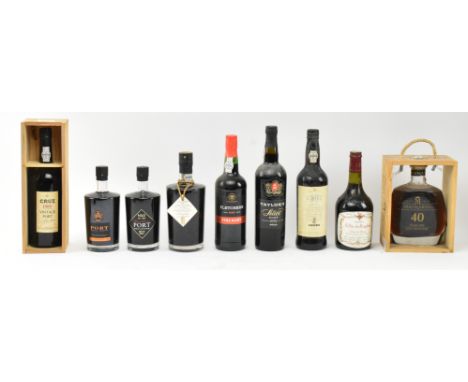 A collection of vintage &amp; later bottles of port. The lot to include a Cruz 1989 vintage port bottle in display wooden cas