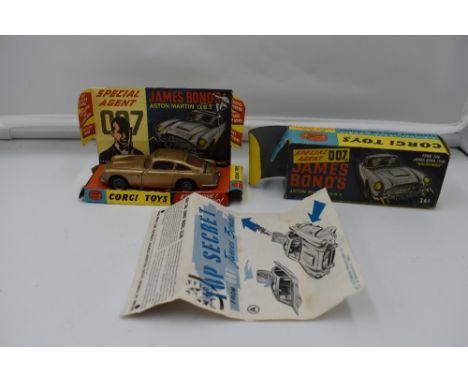 A Corgi diecast, James Bond Austin Martin DB5, in gold with red interior, ejector seat in working order with bandit and drive