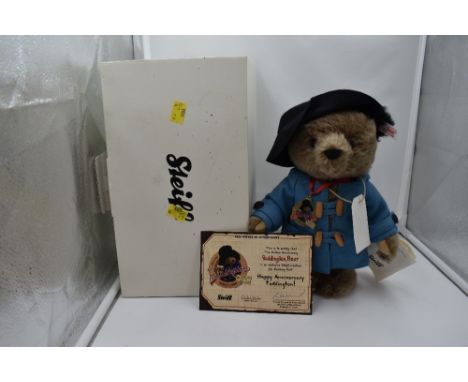 A Steiff Limited Edition 2008 Paddington Bear, wearing blue coat, black hat, medal and label, having white tag in ear 662010,